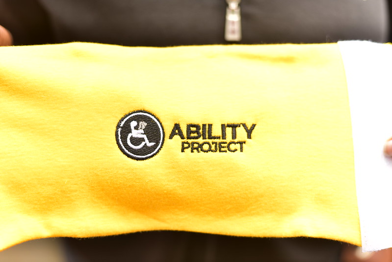 An arm band with the Ability Project logo
